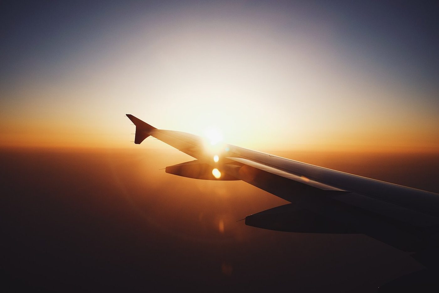 Sunset on plane (Unsplash)